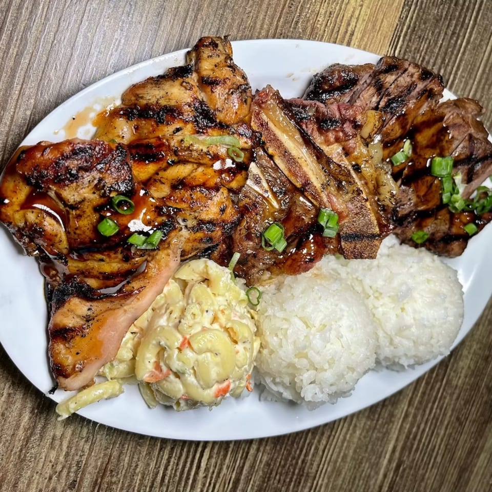 Island Flavor's Hawaiian plate lunch with grilled chicken, ribs, macaroni salad, and white rice.